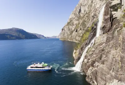 Flam Railway Rail Tour through Norway - Lysefjord electric cruise at waterfall